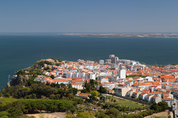 Fototapeta na wymiar Almada city and Tagus River in Portugal viewed from above on a sunny day in the summer.