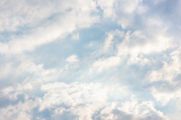 landscape sky with blue clouds and sunbeams at sunset. Background texture