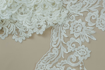 Texture lace fabric. lace on white background studio. thin fabric made of yarn or thread. a...