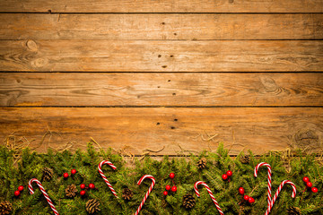 Wooden christmas background with red and green decorative ornament