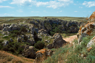 Fototapeta na wymiar Scenic view of huge cliffs. Peaked rocks and cliffs on the seashore