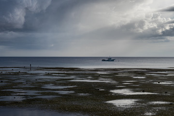 Fishing Boat in the sea before a storm