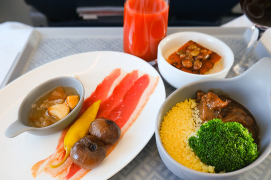 photo of Food served on board of business class airplane on the table