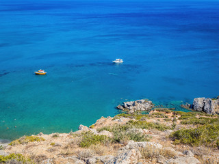 Fototapeta na wymiar Panorama of Preveli beach (Palm beach) at Libyan sea, with river and palm forest, Crete, Greece. Preveli beach and lagoon is located below the monastery in from of an extensive glade of palm trees