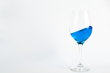 glass whith blue water
