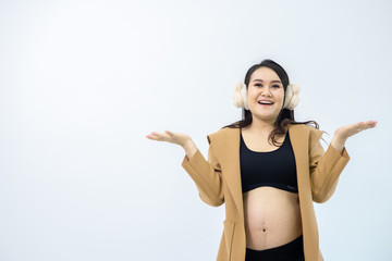 Pregnant women stand away from the white background