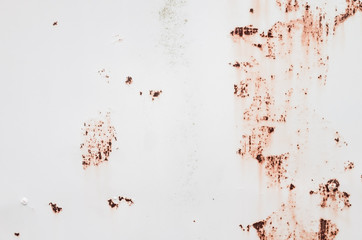 White metal wall with rust spots
