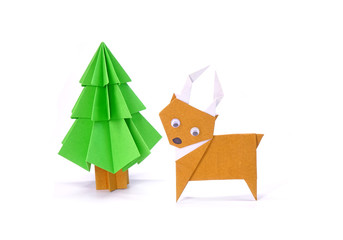 Origami Christmas paper art, Reindeer and Christmas tree for greeting season of Christmas and New year. Copy space