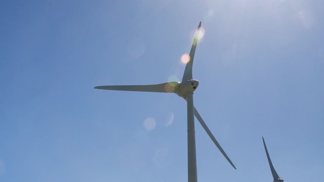Wind turbine farm on Greek mountains. Renewable energy production. Clean energy generators. Greece. Full HD video