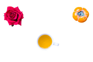 Fresh banana and persimmon in white background and wooden table,