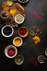 Colorful spice and condiment, nutmeg and cinnamon sticks top view