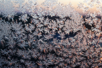 Frost on the window. A beautiful pattern of frost. Frosted glass window. Natural background 