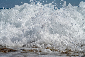Front view of sea waves splashes. Close up