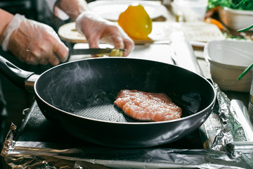 Grilled chicken breast. Grilled chicken fillet and salad of fresh vegetables from tomatoes, cucumbers and arugula leaves. Chicken meat salad. Healthy food. The apartment was lying. View from above.