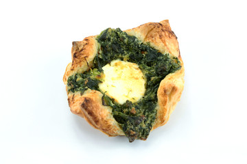puff pastry and spinach on a white background