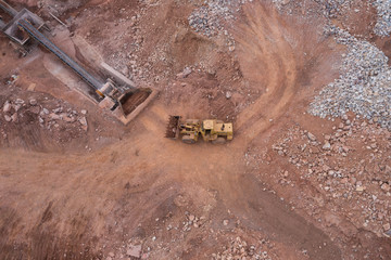 Aerial view of a large bulldozer working in a quarry © bqmeng