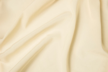 Abstract folds. Delicate silk drapery. Beige color.