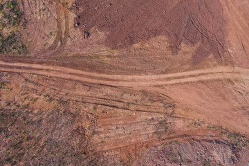 Construction site dry land surface path rough texture background top view