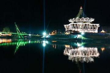 The Darul Hana bridge across Sarawak River overseeing the Sarawak State Assembly Building is popular tourist destination in Kuching.