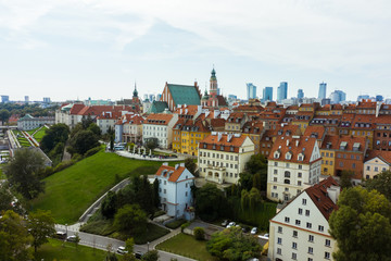 Fototapeta na wymiar Aerial view of old buildings, castles and a church in the old city of Warsaw. Poland. Flight of the drone over the old city on a sunny summer day.