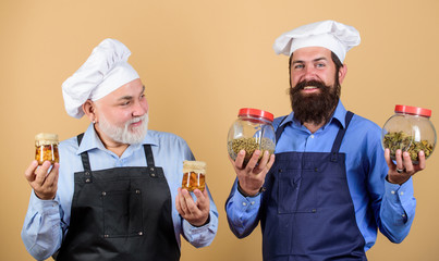Cooking healthy. cheerful men hold food ingredients. prepare food. cuisine concept. healthy eating. professional cook. mature senior bearded men in kitchen. Chef men cooking