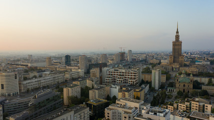 Warsaw, Poland. 26. October. 2019.  Cityscape with skyscrapers and knowledge and roads at sunrise.  Aerial view of the river and the city with skyscrapers and buildings in the early morning.