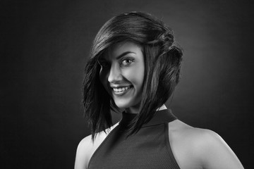 Beautiful brunette with perfect hairstyle and professional  make-up. Black and white.