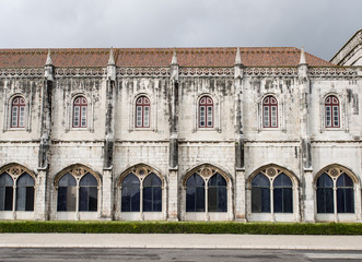 Fototapeta na wymiar Arches with windows in stone monastery in Lisbon
