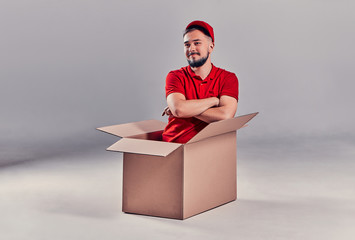 Man on gray background. Courier, Delivery Man.