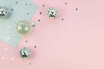 Holiday Christmas top view composition with silver xmas glass balls tree decorations and stars...