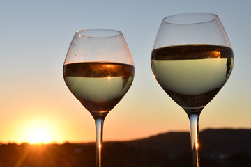 wine glasses in the sunset