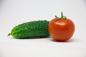 tomato and cucumber on a white background