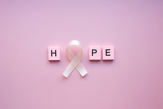 Hope word, and pink ribbon, Breast cancer awareness and October Pink day, world cancer day, national cancer survivor day