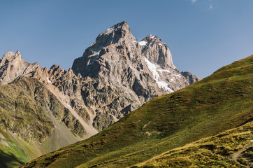 Fototapeta premium Mount Ushba, Main Caucasian ridge. Zemo Svaneti, Georgia. Autumn landscape.