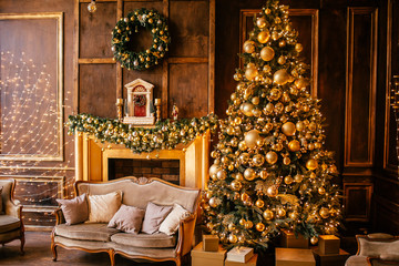 Christmas background with illuminated fir tree with golden decpration and fireplace in living room. Cozy holiday home