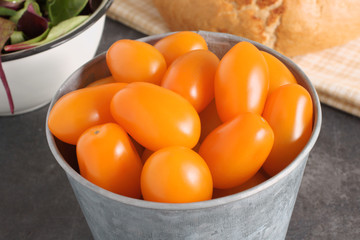 Orange Santa F1 grape tomatoes a hybrid variation of the more usual red tomato.
