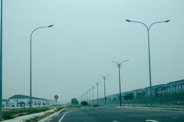 Fototapeta na wymiar Low visibility rural view with dangerous haze and fog in Kuala Lumpur,Malaysia.