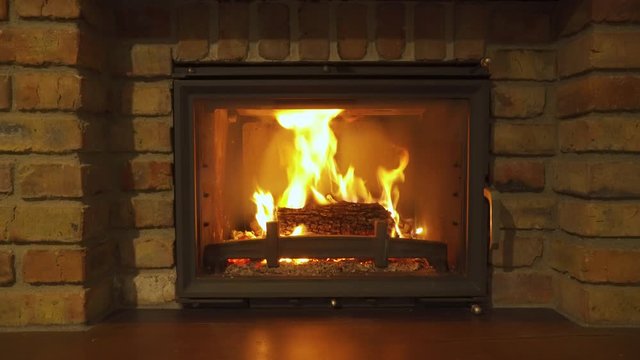 Burning Fireplace - a glowing fire in the stone fireplace to warm at night