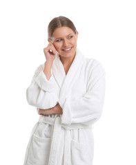 Young woman in bathrobe on white background