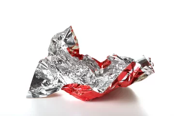 Fotobehang candy red wrapper empty and open isolated on white background with copy space for your text © Andrea