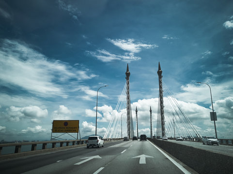 Towers of Bridge connecting George Town on Penang island and Seberang Prai on mainland of Malaysia through straits of Malacca.