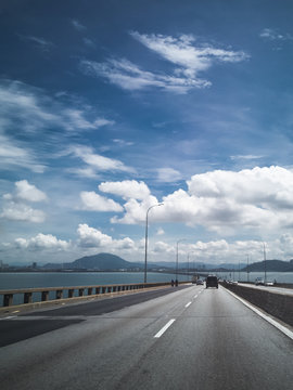 Towers of Bridge connecting George Town on Penang island and Seberang Prai on mainland of Malaysia through straits of Malacca.