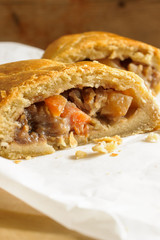 Welsh Oggie a regional delicacy from Wales of lamb leeks and vegetables baked in a short crust pastry case similar to a Cornish pasty
