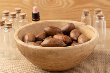wooden bowl with pecan nuts in a rustic environment. Concept of the benefits of pecan oil on health