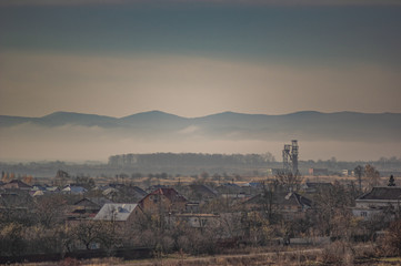 Village in the autumn afternoon in a haze