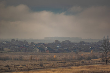 Village in the autumn afternoon in a haze