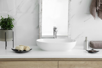 Modern bathroom interior with stylish mirror and vessel sink