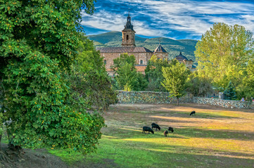 Monastery of El Paular. View of the Monastery of El Paular from the bridge of forgiveness, Rascafr&iacute;a, Madrid, Spain.