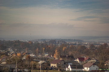 Village in the autumn afternoon in a haze