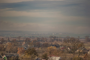 Village in the autumn afternoon in a haze